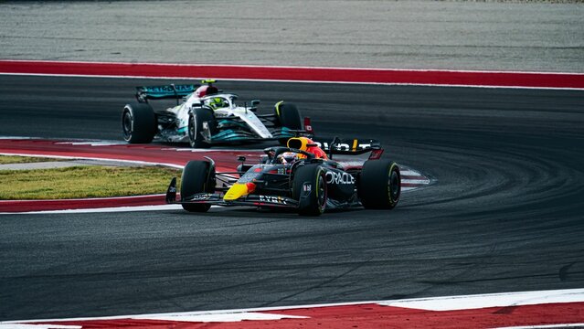 Competition between racing cars of Lewis Hamilton and Max Verstappen on the track at COTA USGP 2022