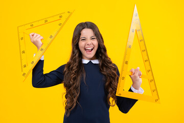 Excited face. Teenager child school girl holding measure for geometry lesson. Measuring height....