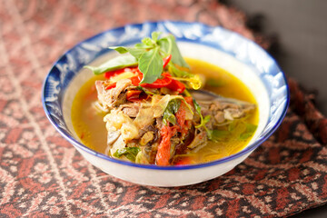 Yellow gravy fish. cooked with turmeric and a mixture of tamarind makes it taste savory and fresh.