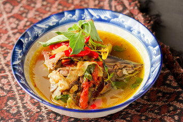 Yellow gravy fish curry. Cooked with a variety of spices, savory and delicious taste.