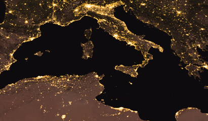 Aerial view of Italy, Sicily, France, Africa, Spain at night. Night view of europe and north africa and Tyrrhenian Sea. Elements of this image furnished by NASA