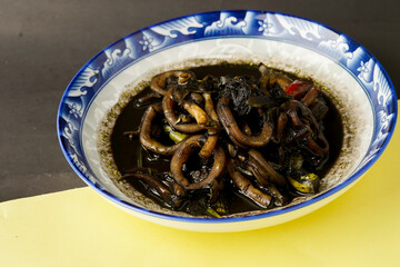 Black Squid Soup. Processed squid cooked with the ink gives the squid a distinctive taste.