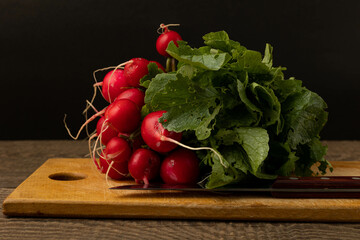 Radish on a wooden chopping board.