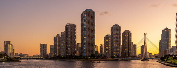 Panoramic view of Tokyo High rise condominium and Sumida river at magic hour.