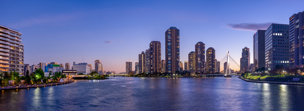 Panoramic view of Tokyo High rise condominium and Sumida river at magic hour.