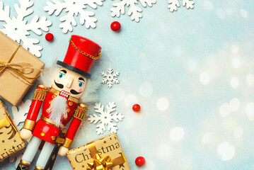 Christmas concept background. Top view of Christmas ornament and christmas wooden nutcracker toy...