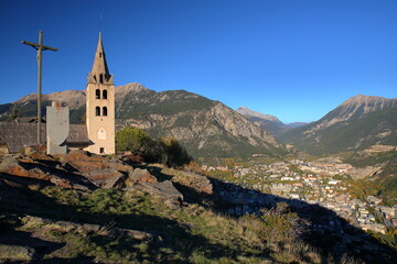 Fototapeta na wymiar The church of Puy Saint Pierre, a perched village overlooking the city of Briancon, Hautes Alpes (French Southern Alps), France