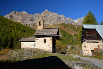 Fontcouverte hamlet located in Vallee de la Claree (Claree Valley) above Nevache village, Hautes Alpes (French Southern Alps), France, with a chapel and traditional wooden chalets (mountain huts)
