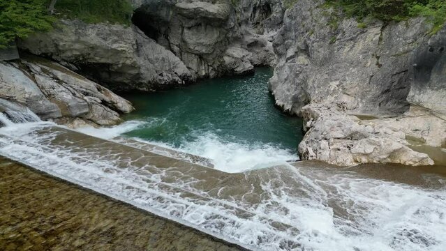 Lechfall Fussen Germany stepped waterfall pull back reveal drone aerial view