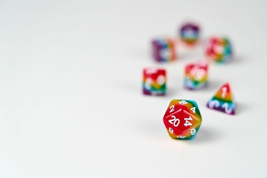 Rainbow dice illustrating the concept of LGBTQ representation and inclusion in tabletop RPG gaming