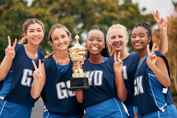 Sports, netball and trophy with a woman team in celebration as a winner group of a victory or...