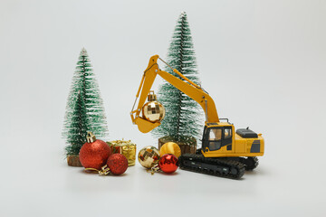 Crawler Excavator  used bucket lift up christmas ornament , Holiday celebration concept new year on...