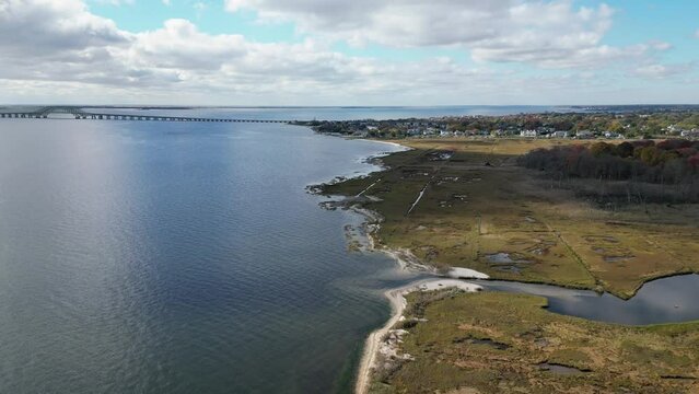 Drone view of long islands south shore looking over Gardiners Park in Bay Shore heading toward the Great South Bay bridges in West Islip New York.