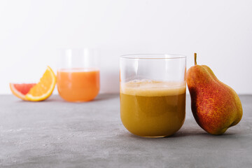 Pear Juice with fresh fruits close up