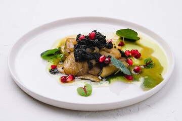 baked eggplant with black caviar on plate