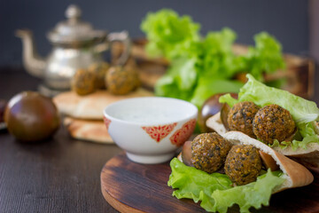 Pita and falafel - oriental food on a table