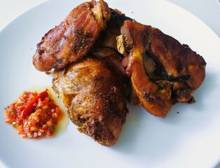 Roast chicken with spicy chili garlic sauce.