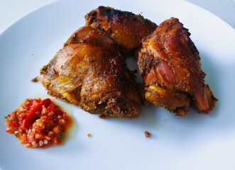 Roast chicken with spicy chili garlic sauce.