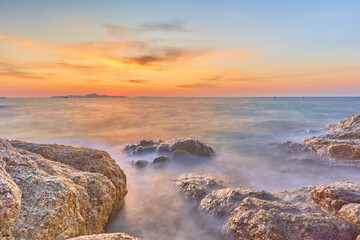 Pattaya Beach (Secret Beach), Pattaya  Thailand - 6 PM November 3rd, 2022: Sunset Perfect Timing at Secret Place in Pattaya Beach with the beautiful Rocks as foreground use for Seascape Photograph