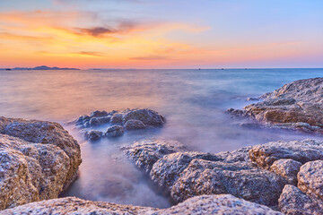 Pattaya Beach (Secret Beach), Pattaya  Thailand - 6 PM November 3rd, 2022: Sunset Perfect Timing at Secret Place in Pattaya Beach with the beautiful Rocks as foreground use for Seascape Photograph