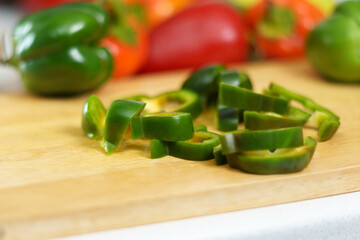 Slices green peppers, which is added to the food to give the taste of the dish