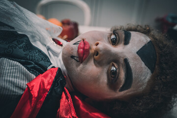 Portrait of african american boy in dracula costume. Halloween night.