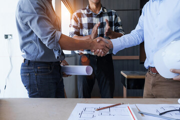 Shaking hands, Successful home renovation describes and examines newly built and renovated...