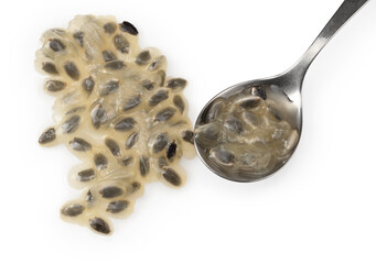 granadilla seend in metal spoon isolated on white background. clipping path