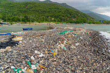 Garbage on the seashore.  The photo was taken in cloudy weather in Vietnam. 
