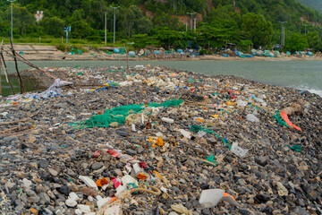 Garbage on the seashore.  The photo was taken in cloudy weather in Vietnam. 