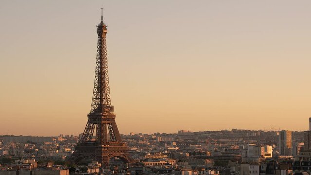 Eiffel tower golden hour during clear sky sunset. Left of Frame. 