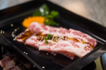 Fresh beef raw sliced with marbled texture served for Sukiyaki and Shabu or Yakiniku