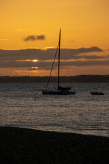 Setting sun over the water with yachts