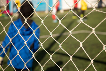 Naklejka premium soccer ball in goal net