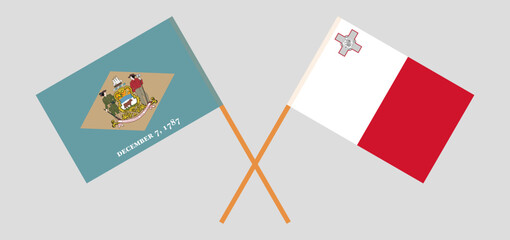 Crossed flags of The State of Delaware and Malta. Official colors. Correct proportion