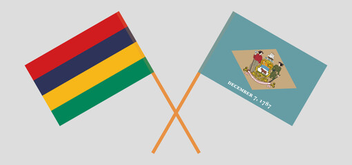 Crossed flags of Mauritius and The State of Delaware. Official colors. Correct proportion