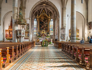 Interior of the majestic St. Cyricus and Julitta Church. Gothic church of the Termeno.village (Tramin) in South Tyrol Trentino Alto Adige – Italy - October 31, 2022