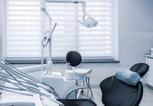 Modern dental practice. Dental clinic interior with working tools. Dental chair and other accessories
