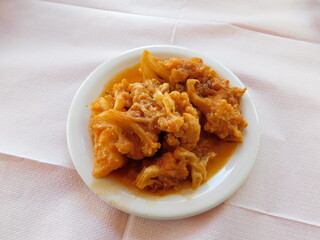 Boiled cauliflower in red sauce