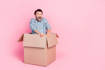 Full body photo of nice young guy excited sit box ready relocate post service dressed trendy blue...