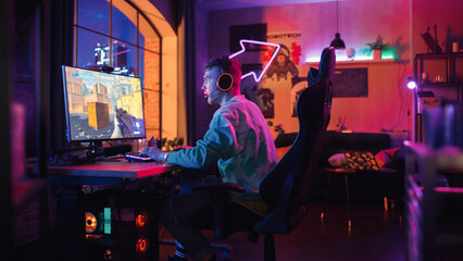 Gaming at Home: Gamer Frustrated by Losing a Round of Playing Online Video Game on Personal Computer. Saddened Male Playing Shooter Arcade Online Multiplayer PvP Tournament. Evening at Home.