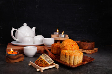 Mooncakes on a wooden tray or Mid-Autumn Festival for auspiciousness (spot focus)