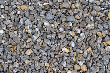 Close-up of the texture of multi-colored granite rubble.