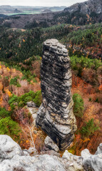 Colorful autumn trees and rock formations in Bohemian Switzerland