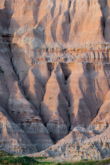 A simple background image of eroded mountains in the Badlands National Park in South Dakota. Vertical image with nobody in it. 