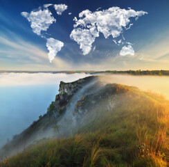 clouds in the form of a world map over the river canyon. Travel and landscape concept. autumn morning