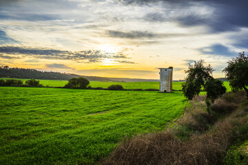 House in a green prairie at sunset in the countryside of Chamusca - Portugal