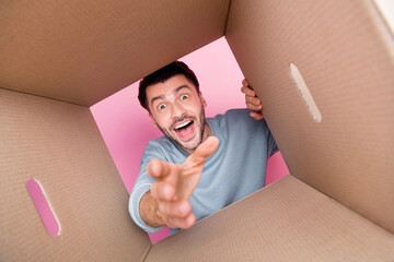 Photo portrait of attractive young guy unwrap look inside opened carton box dressed trendy blue...