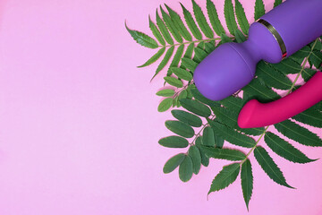 Sex toys. Pink and purple vibrators on a pink background. Useful for adult, sex shop