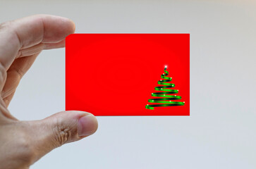 Hand holding a Christmas card